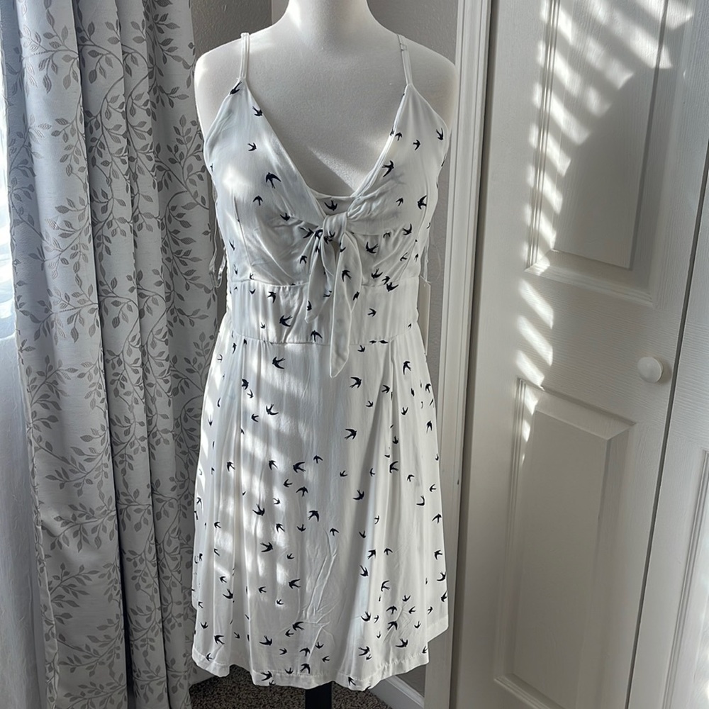 White with navy blue birds.